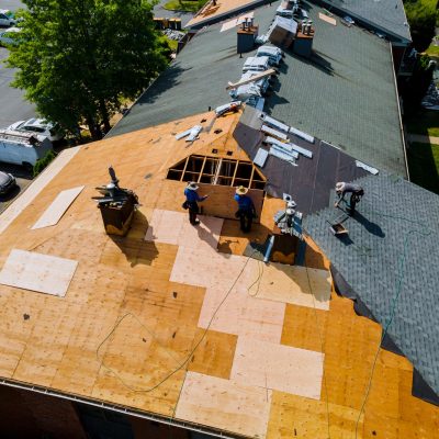 Professionals working on a roofing project in Lafayette, LA